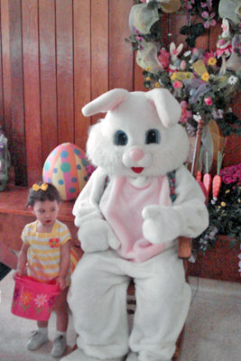 An image of an Easter Bunny with a toddler.