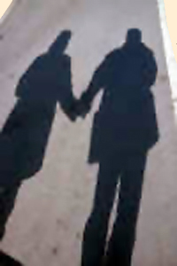 An image of couple and their shadows.
