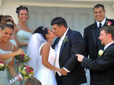 An image of a wedding kiss.