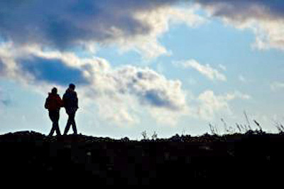 An image of a couple at a coastline.
