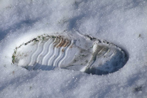 An image of footprint in the snow.