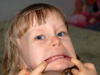 An image of a little girl making a face.