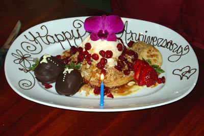 An image of “Happy Anniversary” spelled out in chocolate on a plate at a restaurant in Tucson, AZ.