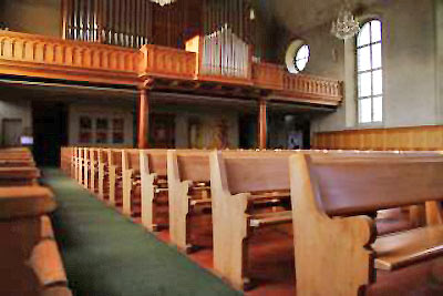 A photo of church pews.