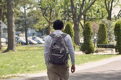 A photo of a student heading towards his class.