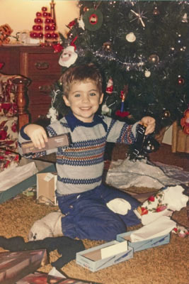 A color photo of Merrill Webb receiving his model train at Christmas 1978.