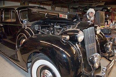 A photographic image of a vintage Packard automobile.