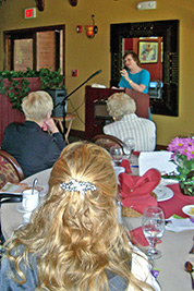 A photographic image of Mary Hunt 						Webb speaking to a group in Arizona.