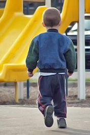 A photographic image of a running boy.