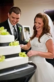 A photographic image of rows of a bride and groom cutting their wedding cake.