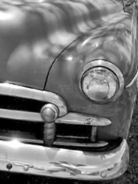 A photographic image of a left-front fender of a Chevy DeLuxe.