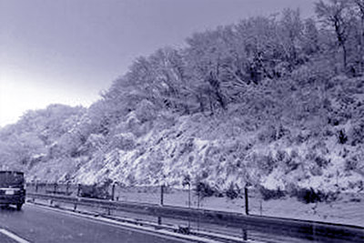 A photographic image of a snowy highway.