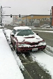 A photographic image of a snowy street.