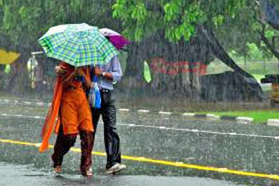 A photographic image of a couple walking in the rain.