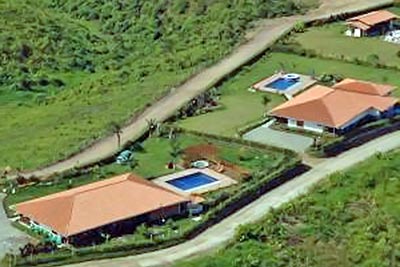 A photographic image of country houses with private swimming pools.