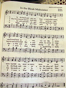 A photographic image of a hymn in a hymnal.