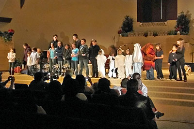 A photographic image of church-based 						Christmas program.
