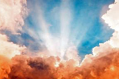 A photographic image of a blue sky with clouds.