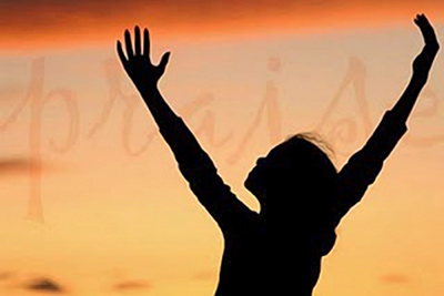 A photographic image of a woman worshiping.