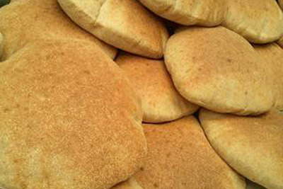 A photographic image of loaves of pita bread.