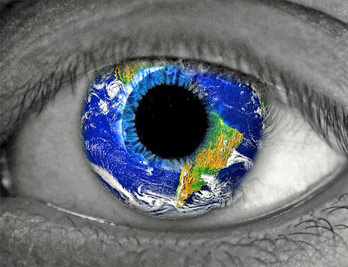 A photographic image of an eye superimposed on planet Earth.