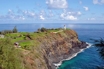 A photographic image, taken from a distance, of the Kilauea Lighthouse on the island of Kauai.
