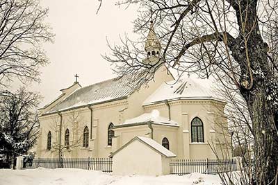 A photographic image of a church in Poland that's covered in snow.