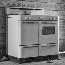 A photographic image of a vintage cooking stove.