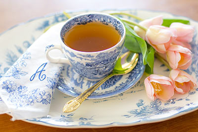 A photographic image of a teacup and napkin.