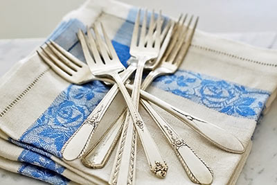 A photographic image of vintage silverware.