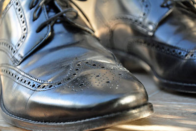 A photographic image of a man's shoes.