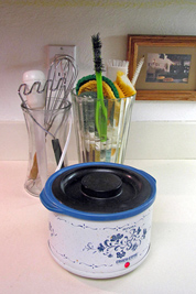 A photographic image of a slow cooker and flower vases.