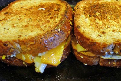A photographic image of a grilled cheese sandwich.