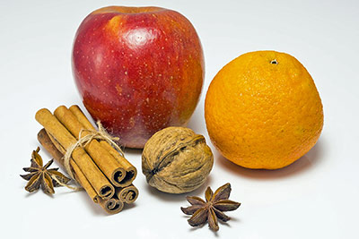 A photographic image of fruits and a walnut.