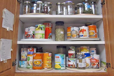 A photographic image of canned goods in our cupboard.