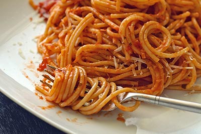A photographic image of cooked spaghetti.