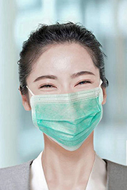 A photographic image of a smiling lady wearing a mask.
