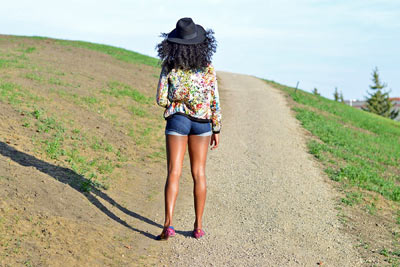 A photographic image of a girl wearing shorts.