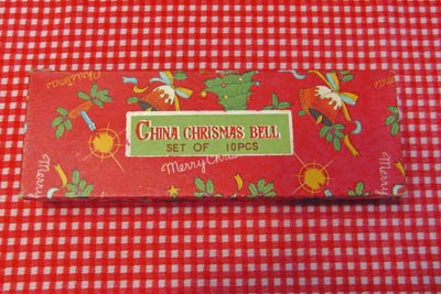 A photographic image of a box that contains Christmas ornaments.