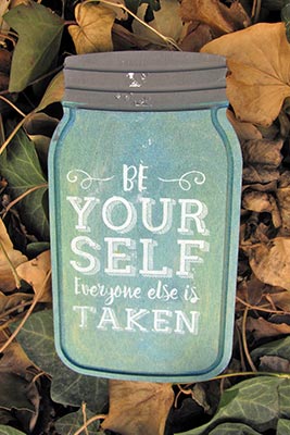 A photographic image of a 'Be yourself. Everyone else is taken' plaque.