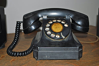 A photographic image of a dial telephone.