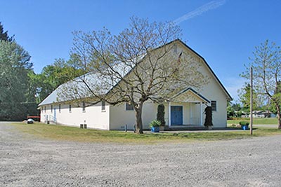 A photographic image of a barn that was transformed into a church.