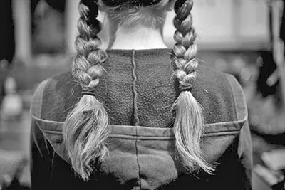 A photographic image of a girl with braids.