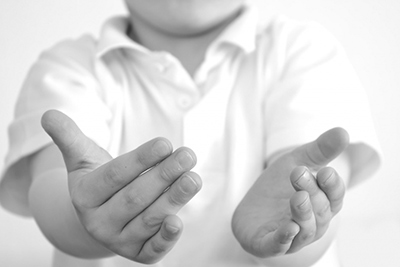 A photographic image of a child's hands