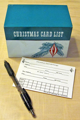 A photographic image of a Christmas card list box.