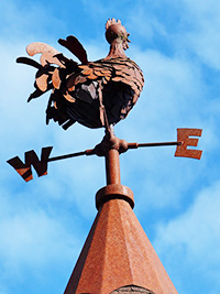 A photographic image of a weather cock.
