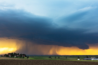 A photographic image of an isolated thundershower.