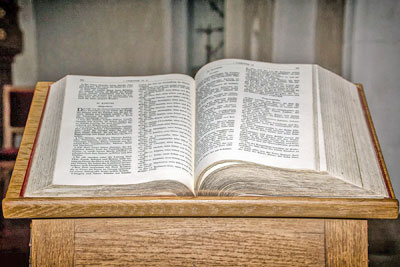 A photographic image of a Bible on a lectern.
