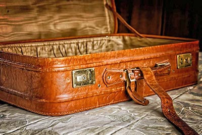 A photographic image of a vintage suitcase.