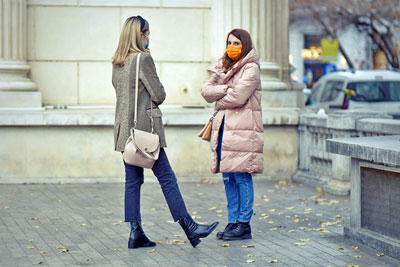 A photographic image of two women talking.